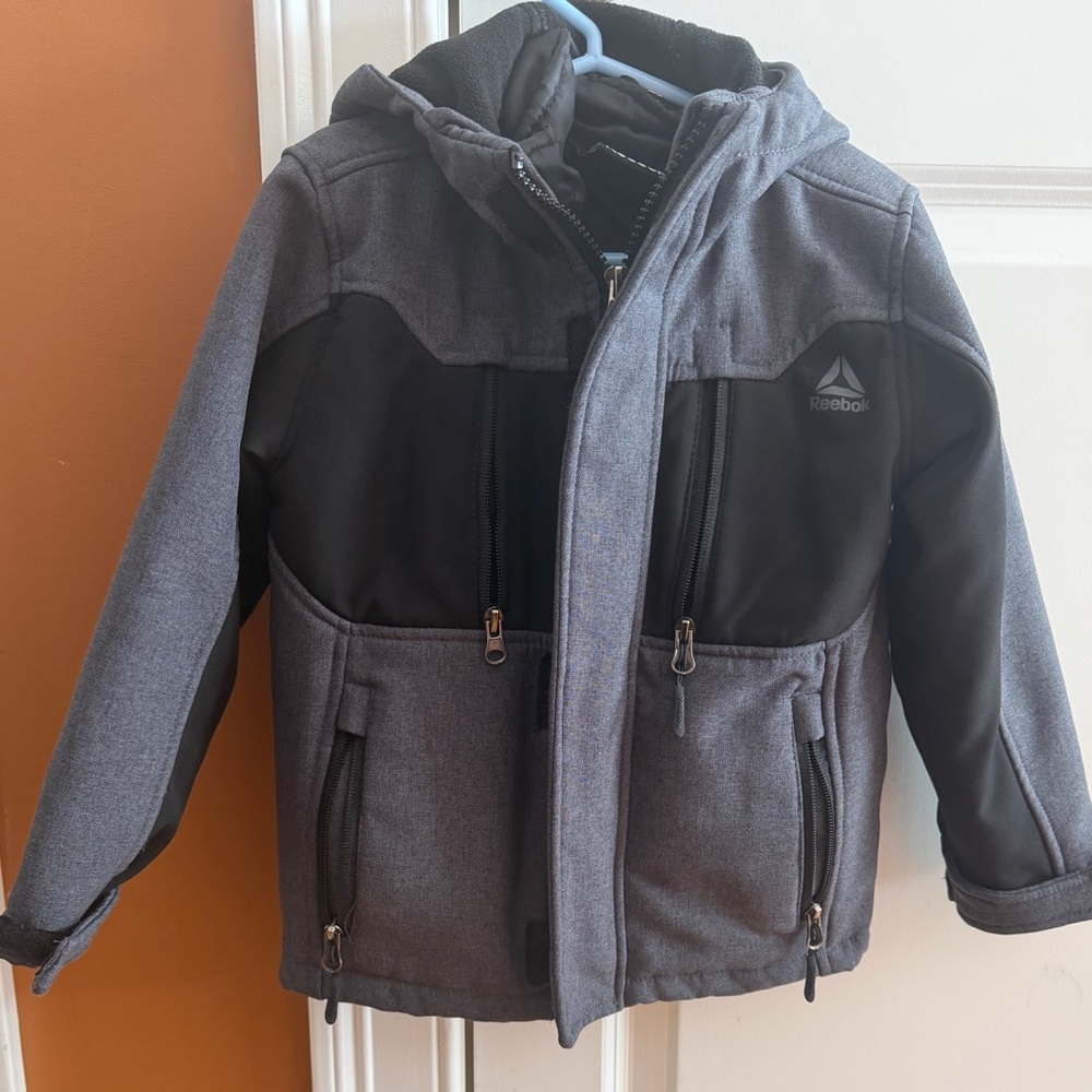 Reebok Kids Gray with black. Boy's 3-in-1 heavyweight water resistant jacket.